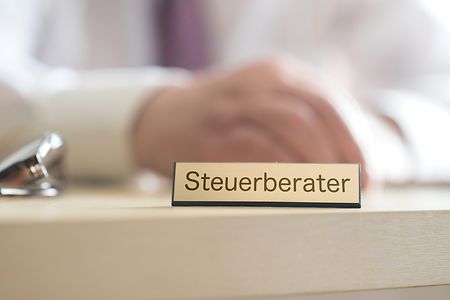 A Tax Consultant works in his Office